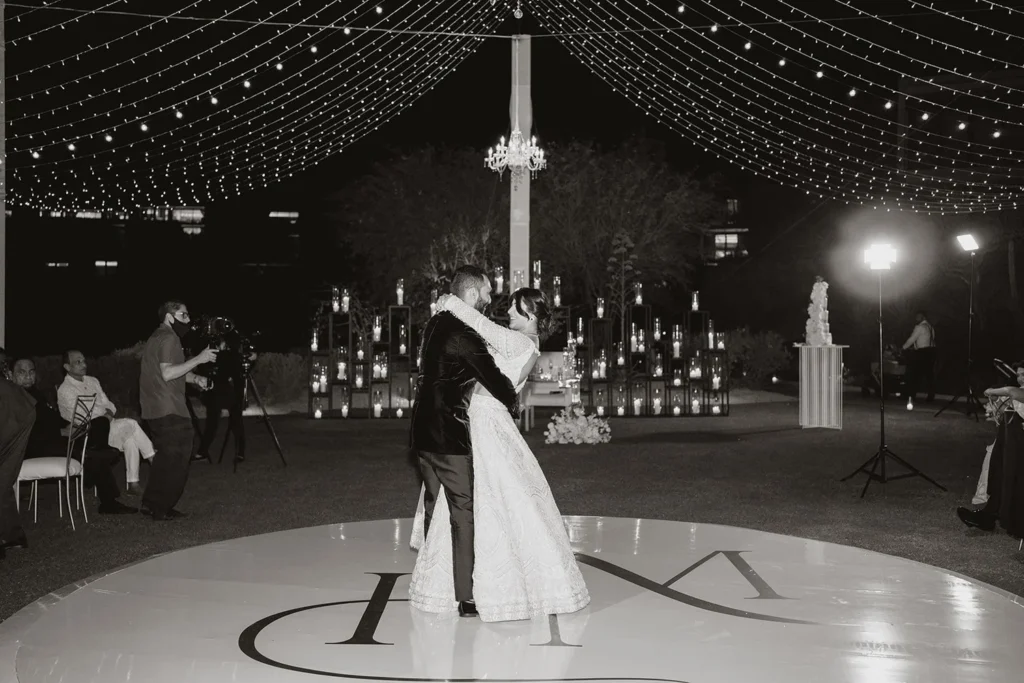 First Dance, round dance floor with monogram, black and white editorial photo with romantic candles.