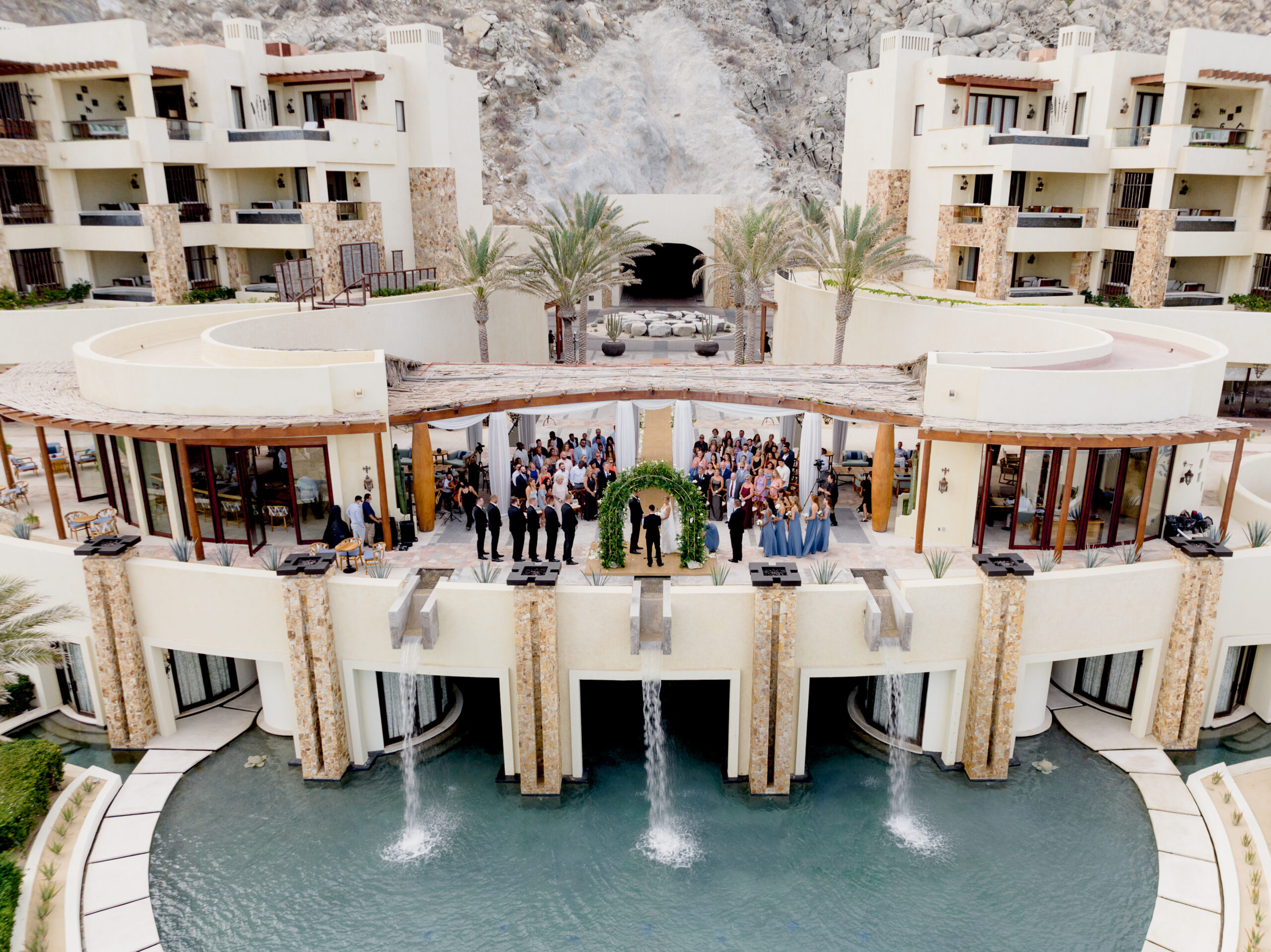 Aerial view of an oceanfront wedding ceremony at Waldorf Astoria Los Cabos